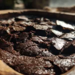 Chocolate Dump Cake Recipe – The Best 4-Ingredient Dessert Ever! 3 Freshly baked chocolate dump cake in a rustic dish with gooey layers